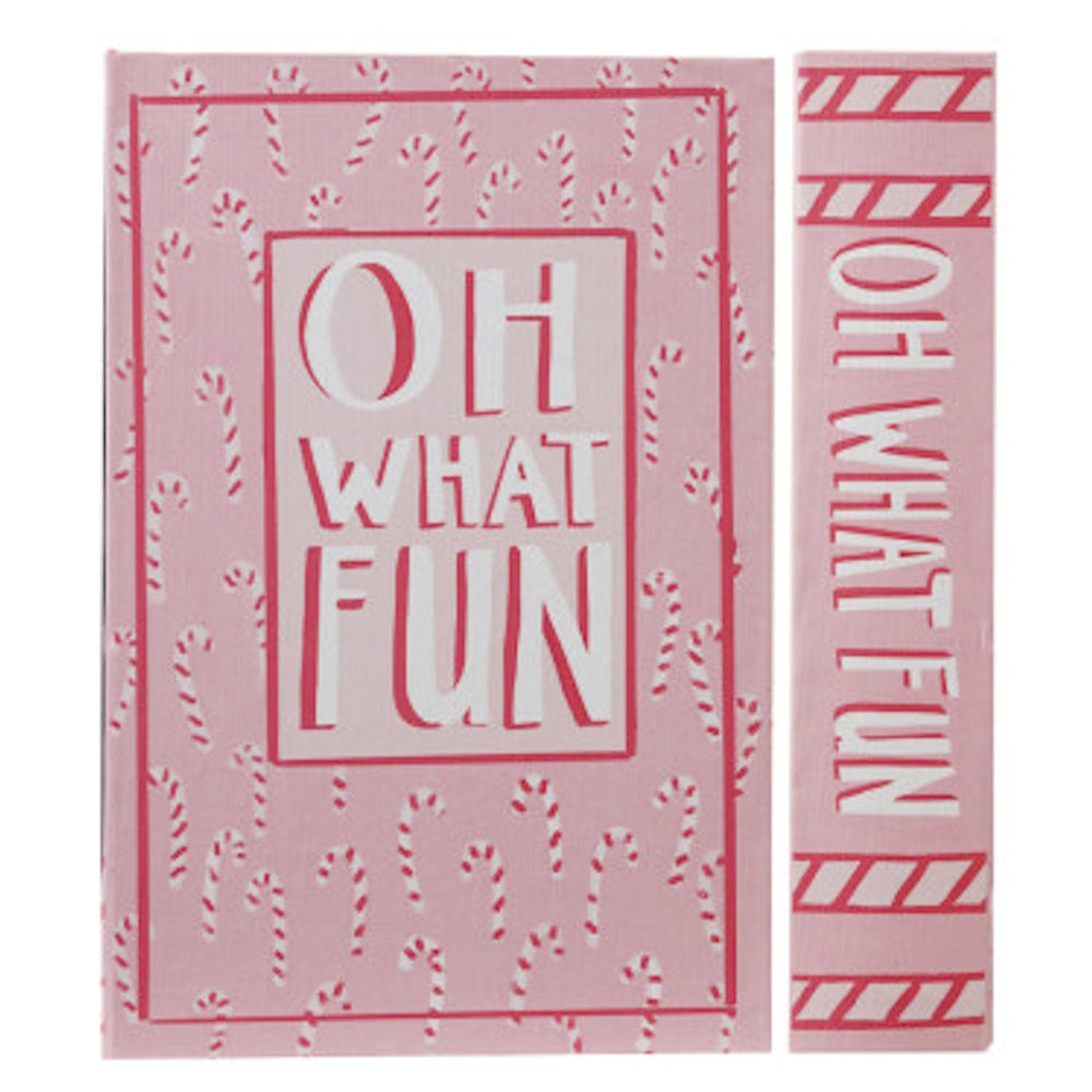 Pink holiday book-shaped storage box featuring a candy cane pattern and the words "OH WHAT FUN".