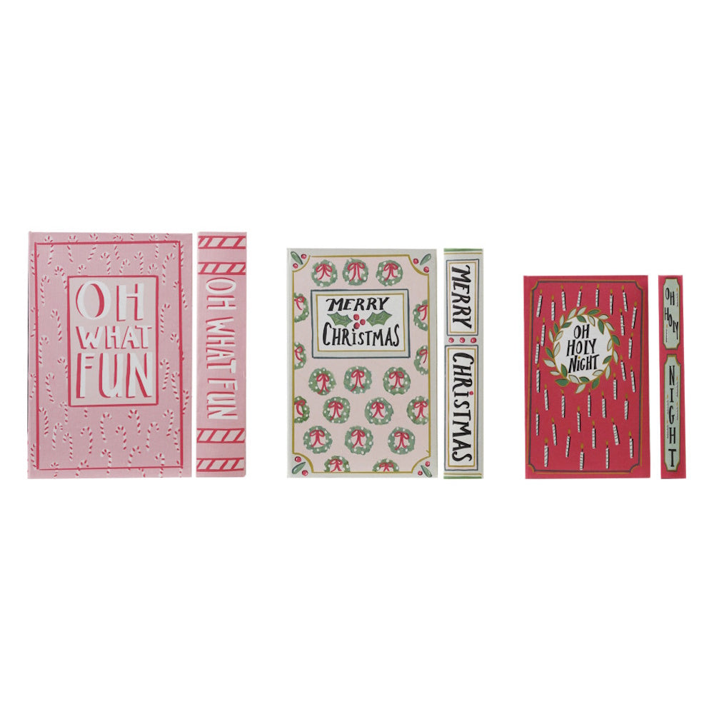 Three festive Christmas book-shaped storage boxes displaying front covers and spines.