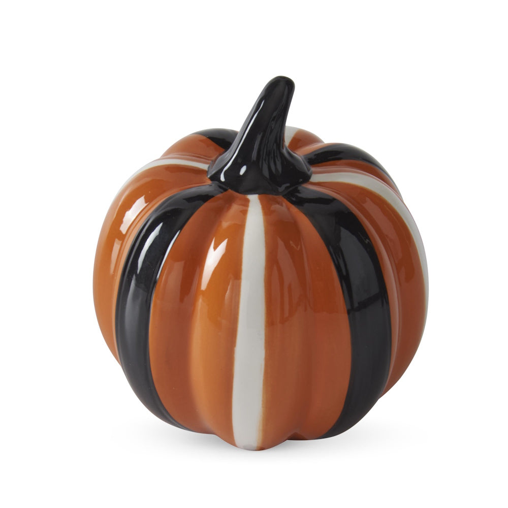 Glossy orange ceramic pumpkin featuring black and white vertical stripes and a black stem.