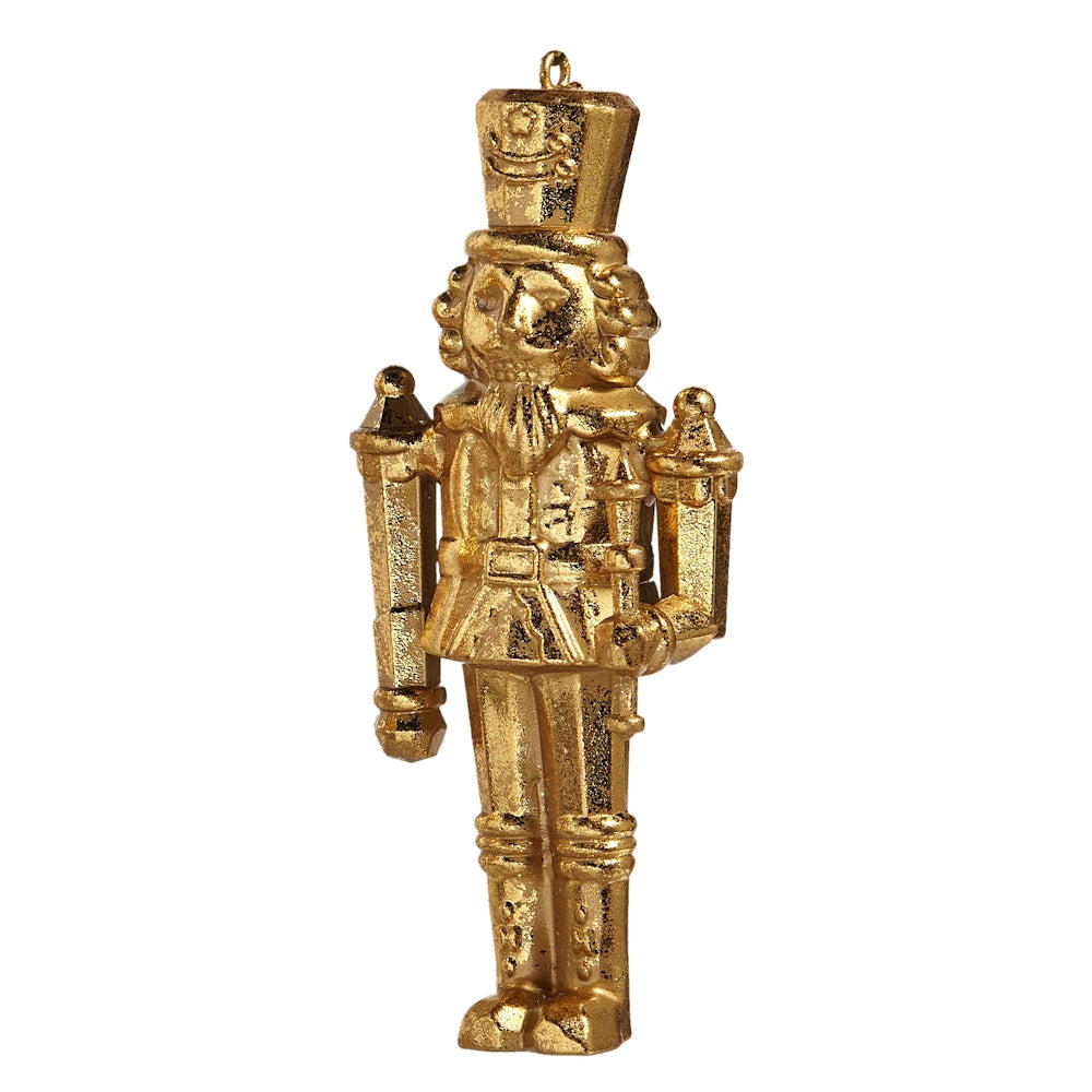 Gold nutcracker Christmas tree ornament with a textured finish and holding a staff.