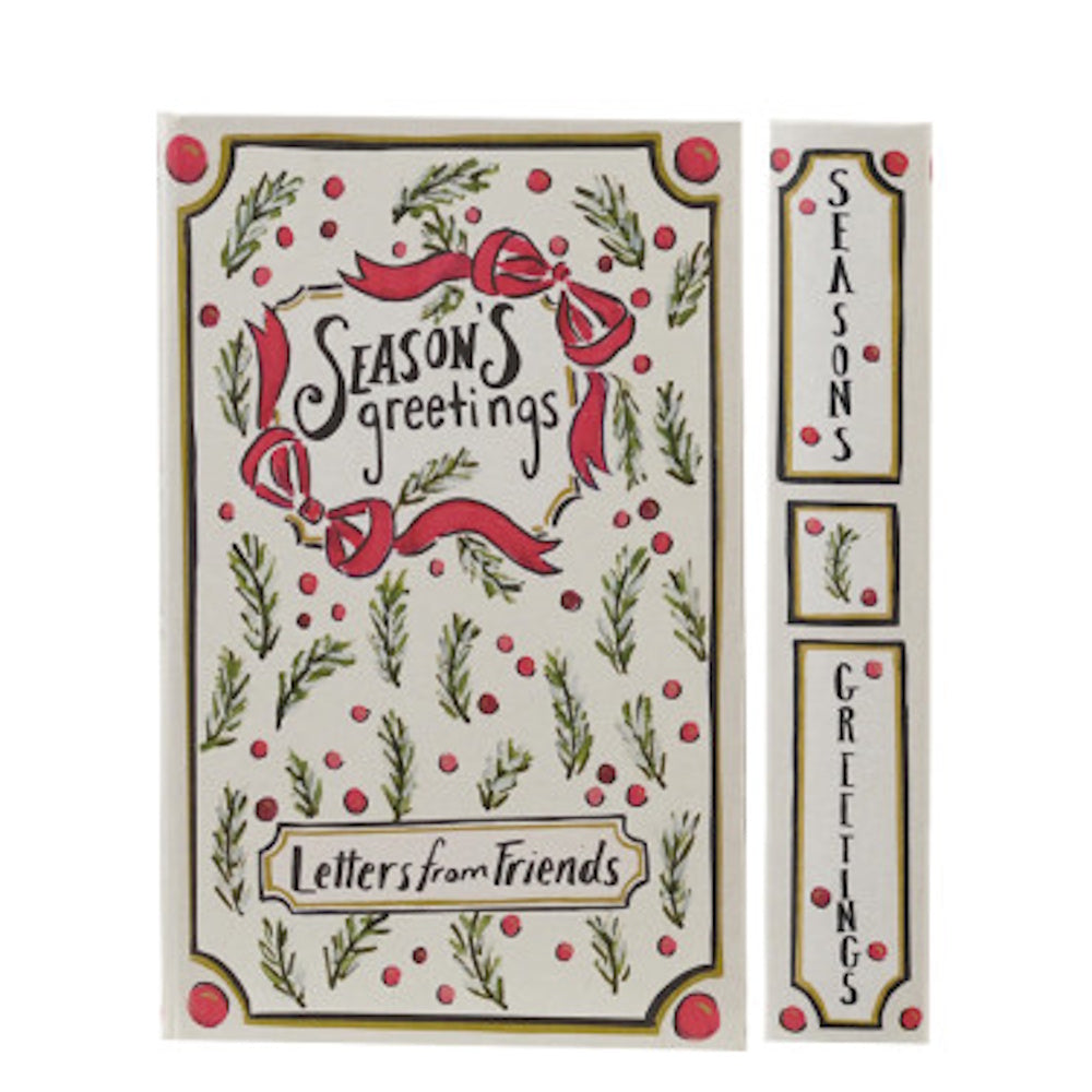 White Christmas book-shaped storage box adorned with red bow illustrations and "Season's Greetings" text.