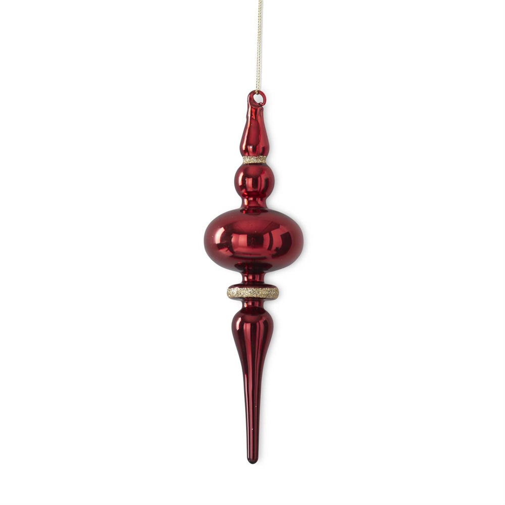 A hanging red glass finial ornament with gold glitter trim.