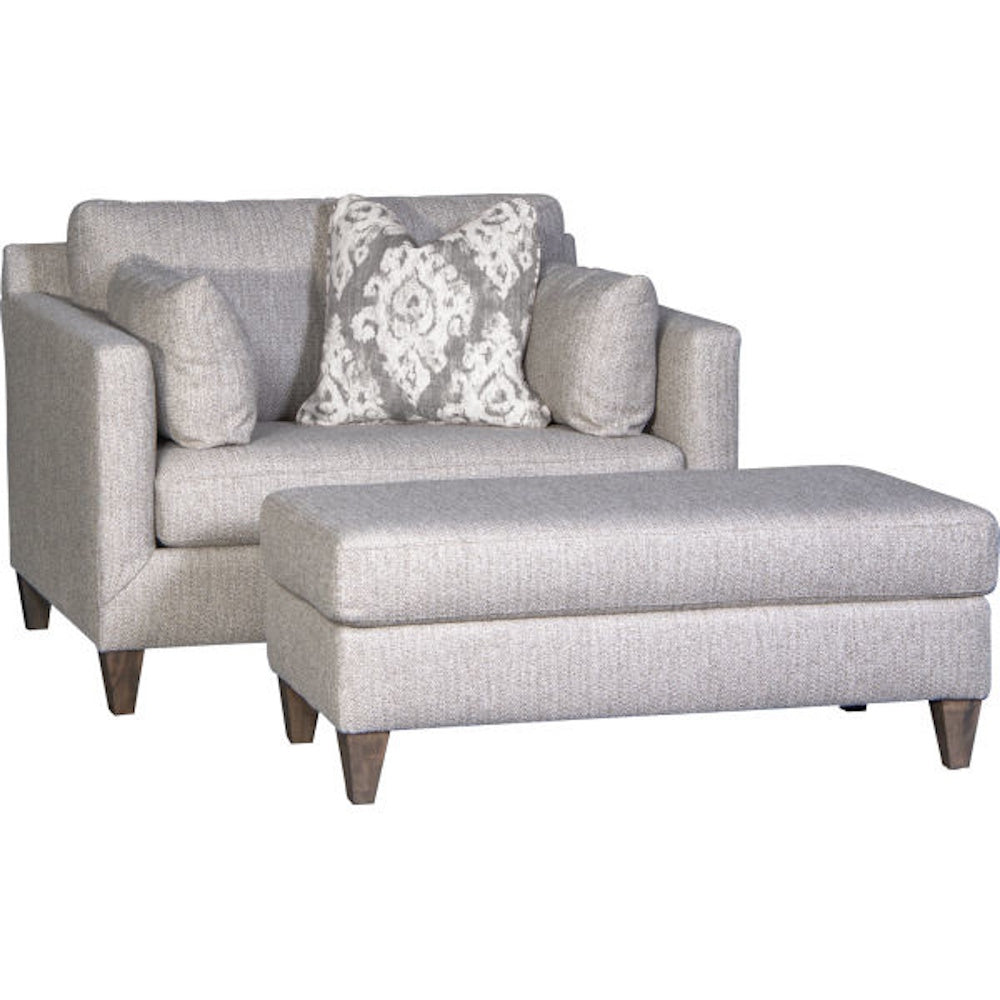 Light gray linen armchair and matching rectangular ottoman set with patterned throw pillow.
