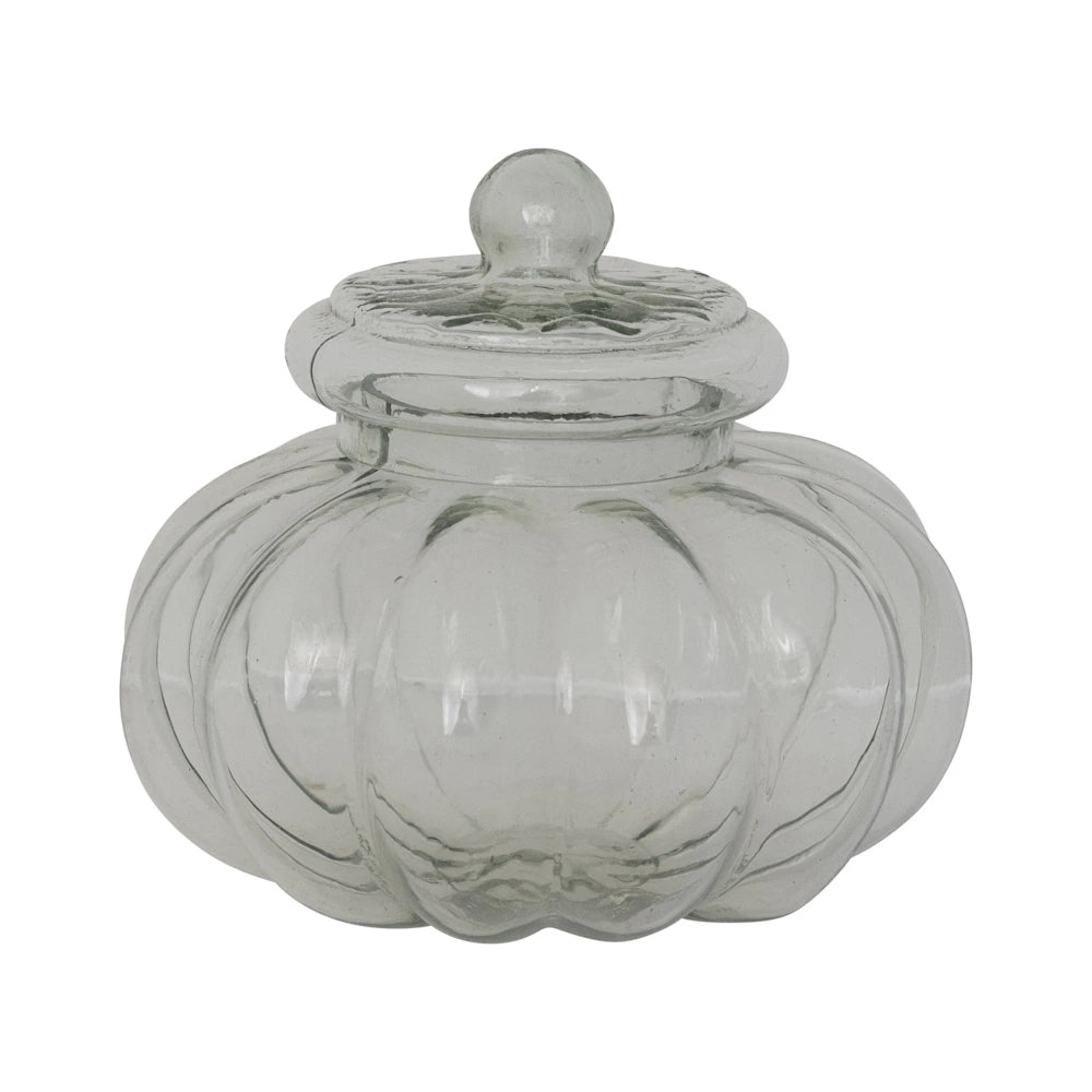 Clear ribbed glass jar with a matching lid and round knob handle on a white background.