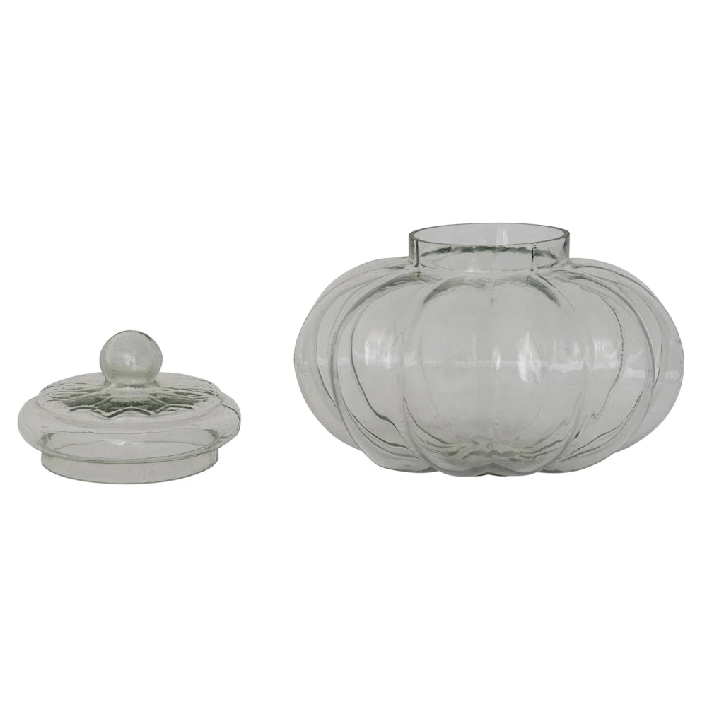 Clear ribbed glass pumpkin-shaped storage jar with a matching lid on a white background.