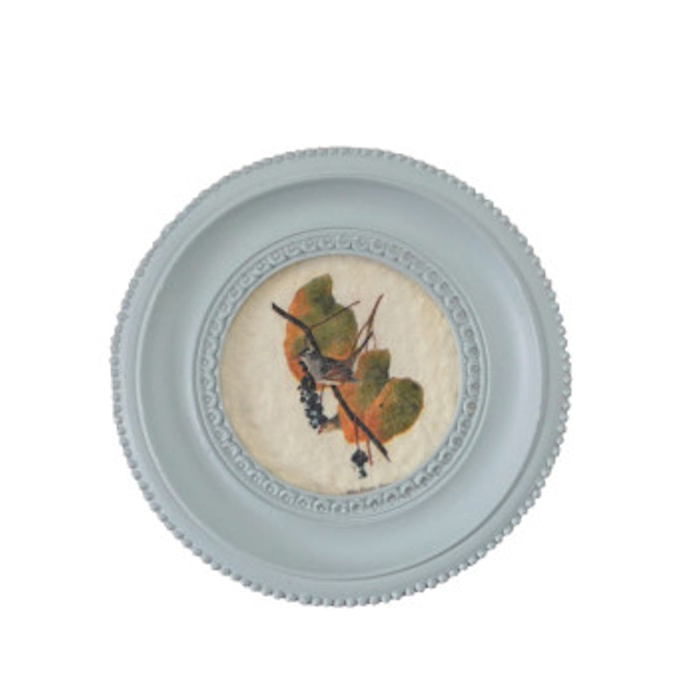 Round light blue mini framed art magnet featuring a vintage bird and leafy branch illustration.