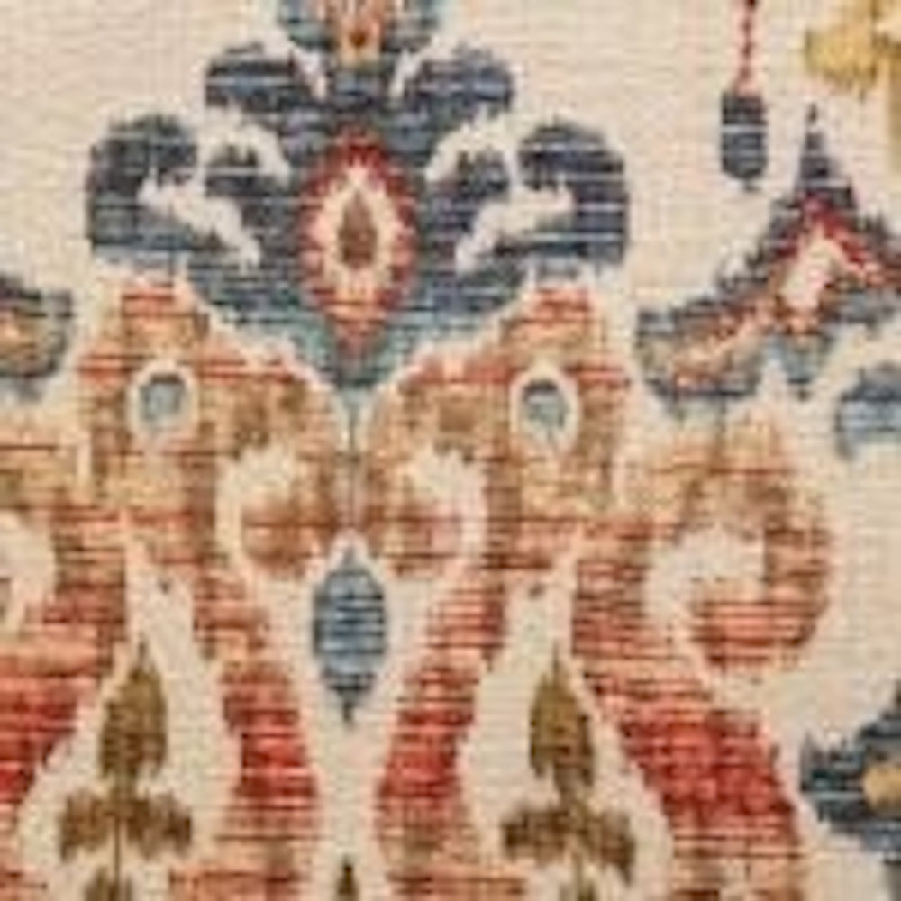 Fabric swatch detail showing an intricate ikat damask pattern in blue, terracotta, and gold hues.