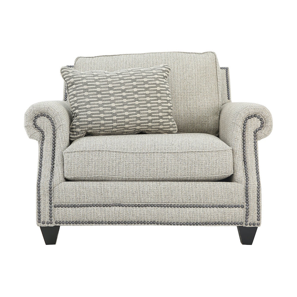 Front view of a light gray upholstered armchair with rolled arms and nailhead trim.