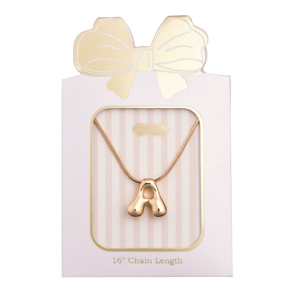 Gold puffy initial letter "A" pendant necklace packaged on a gift card topped with a gold bow.
