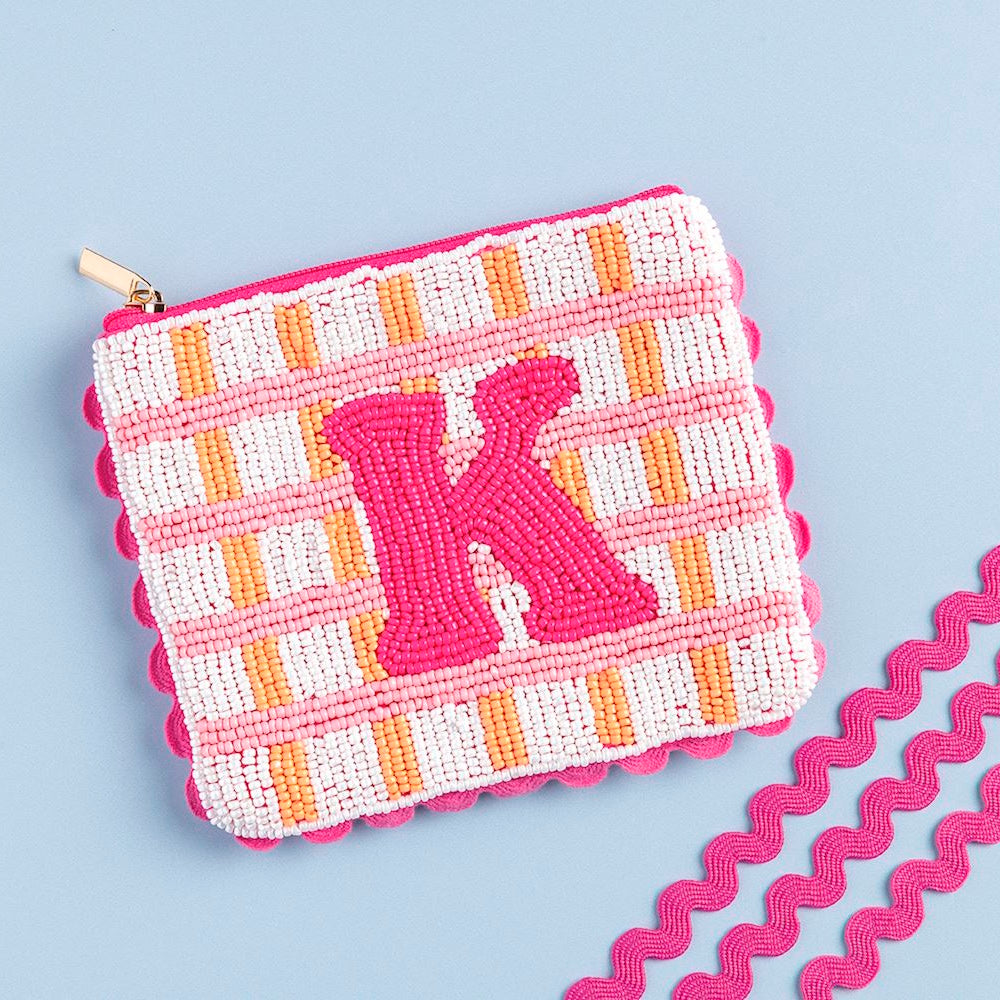 Beaded pouch featuring pink, white, and orange plaid with a bold pink initial "K" and scalloped edge.