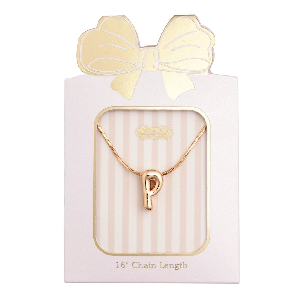 Gold initial "P" pendant necklace packaged in a pink box with a gold bow design.