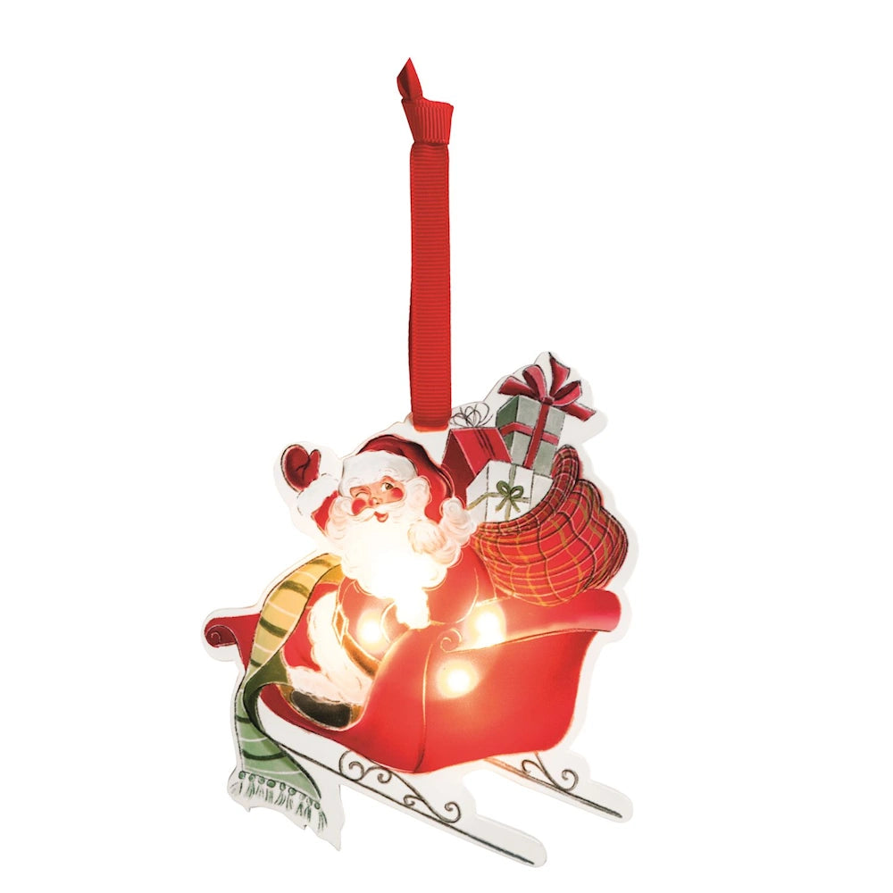 Light-up Christmas ornament featuring winking Santa in a red sleigh filled with gifts, on a red ribbon.
