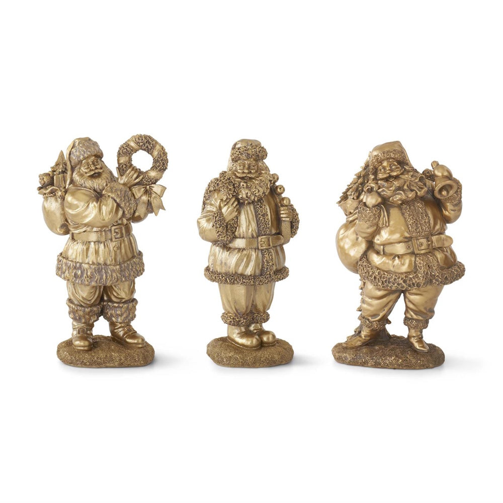 A set of three antique gold resin Santa Claus figurines in different poses.