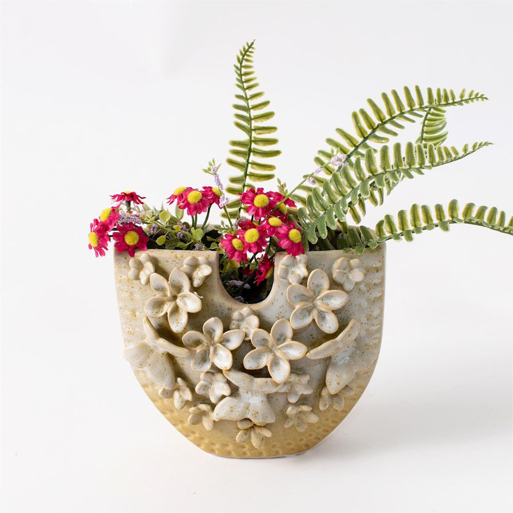 Beige ceramic floral vase holding pink daisies and green ferns, featuring 3D butterfly accents and a speckled finish.