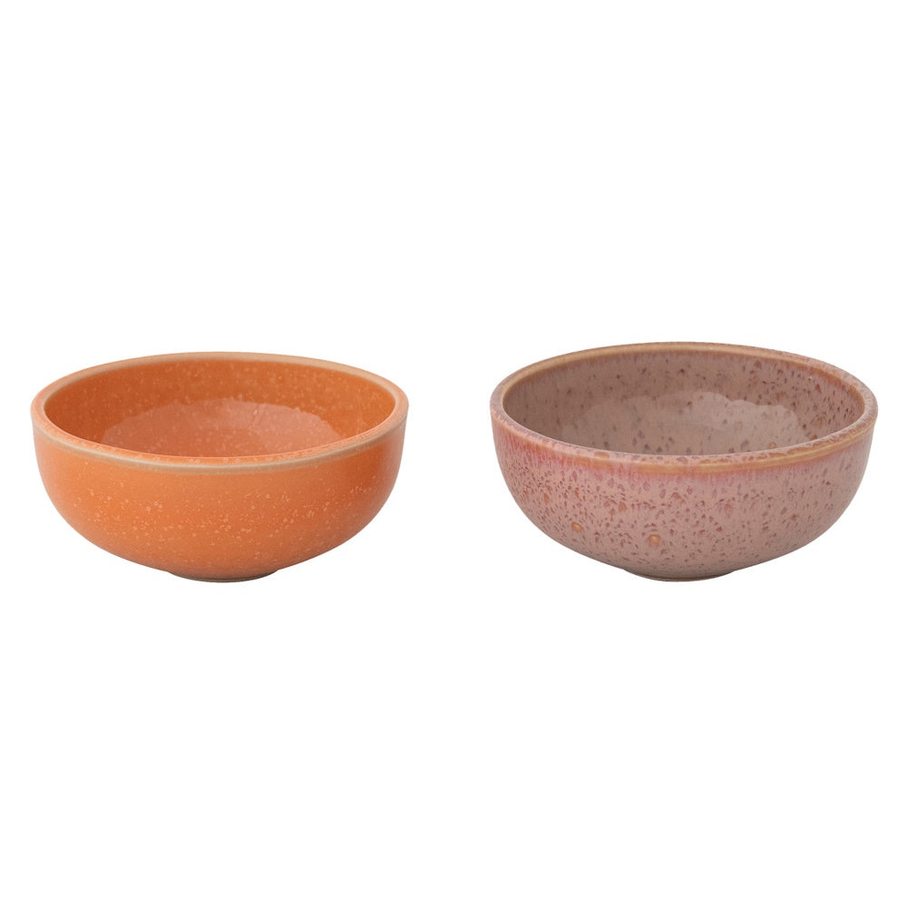 Two small stoneware bowls side-by-side, one a speckled apricot orange and the other a speckled berry pink.
