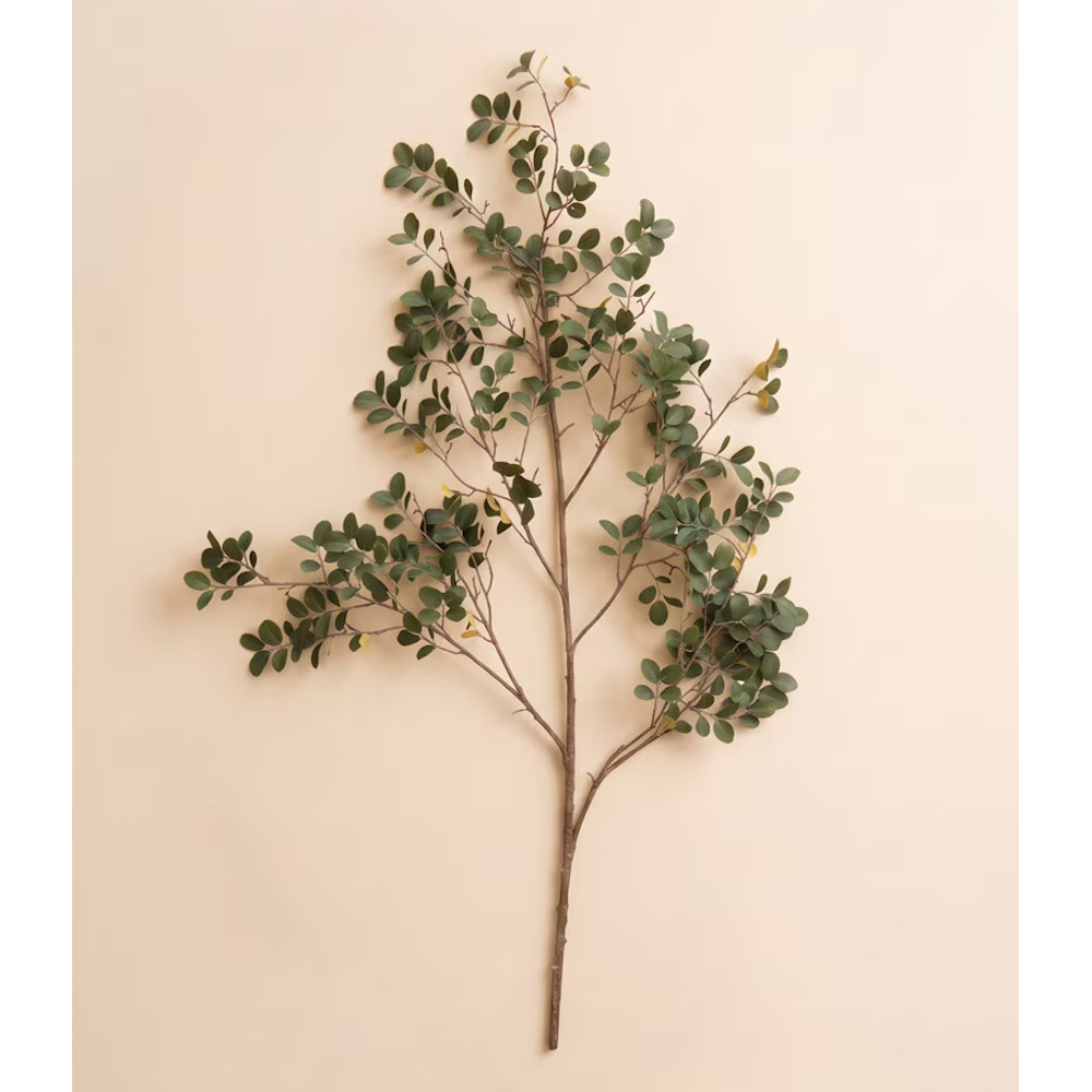 Single artificial green crape myrtle spray stem displayed flat on a light beige backdrop.