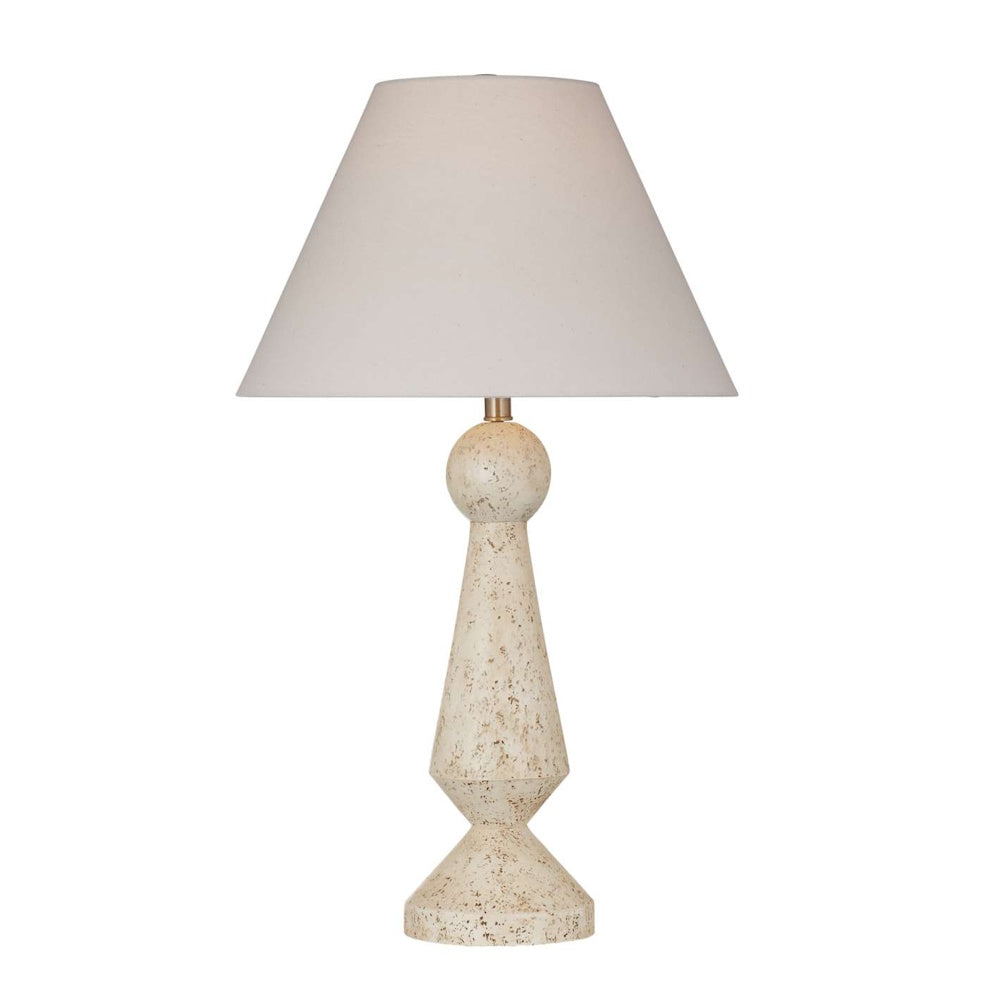 Modern beige speckled table lamp featuring a geometric sculpted base and a tapered fabric lampshade.