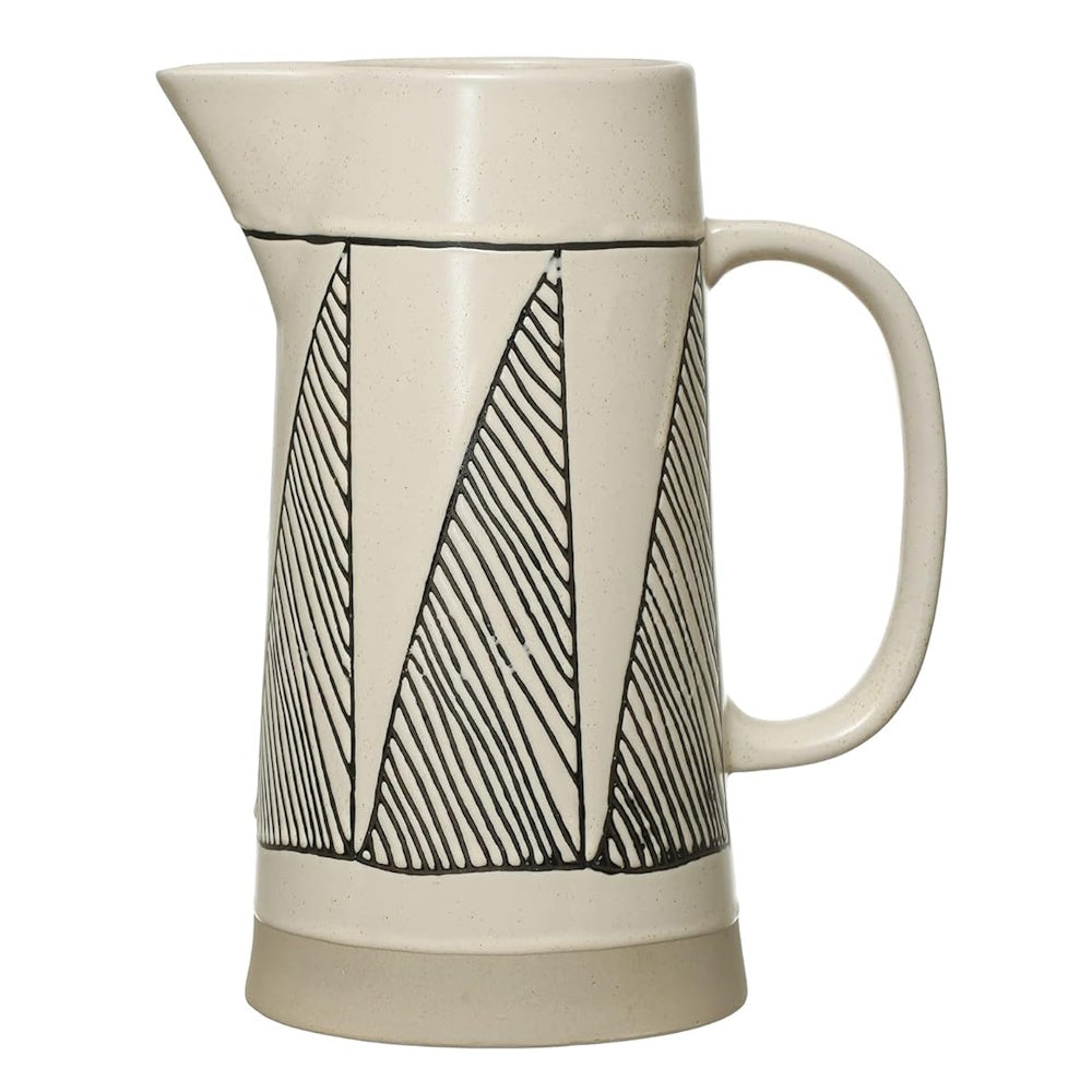 Cream stoneware pitcher featuring a textured black geometric triangle pattern and a smooth gray base.