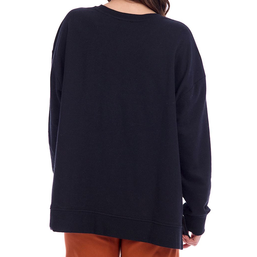 Back view of a person wearing a plain black crewneck sweatshirt.
