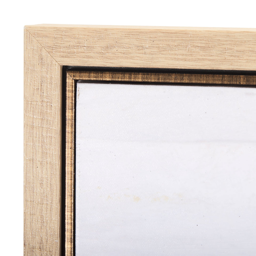 Close-up of the light wood frame with a thin dark inner border surrounding the canvas.