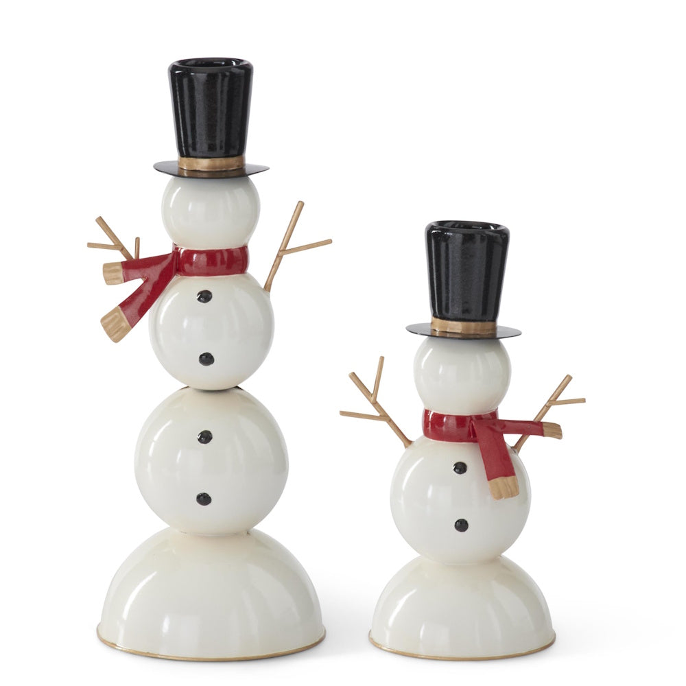 Set of 2 white metal snowman taper candleholders with black top hats and red scarves.