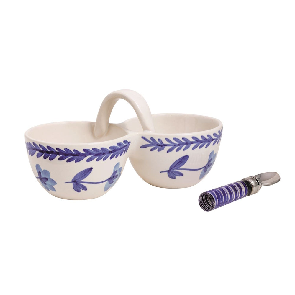 Hand-painted blue floral ceramic double condiment server with handle and matching small metal serving spoon.