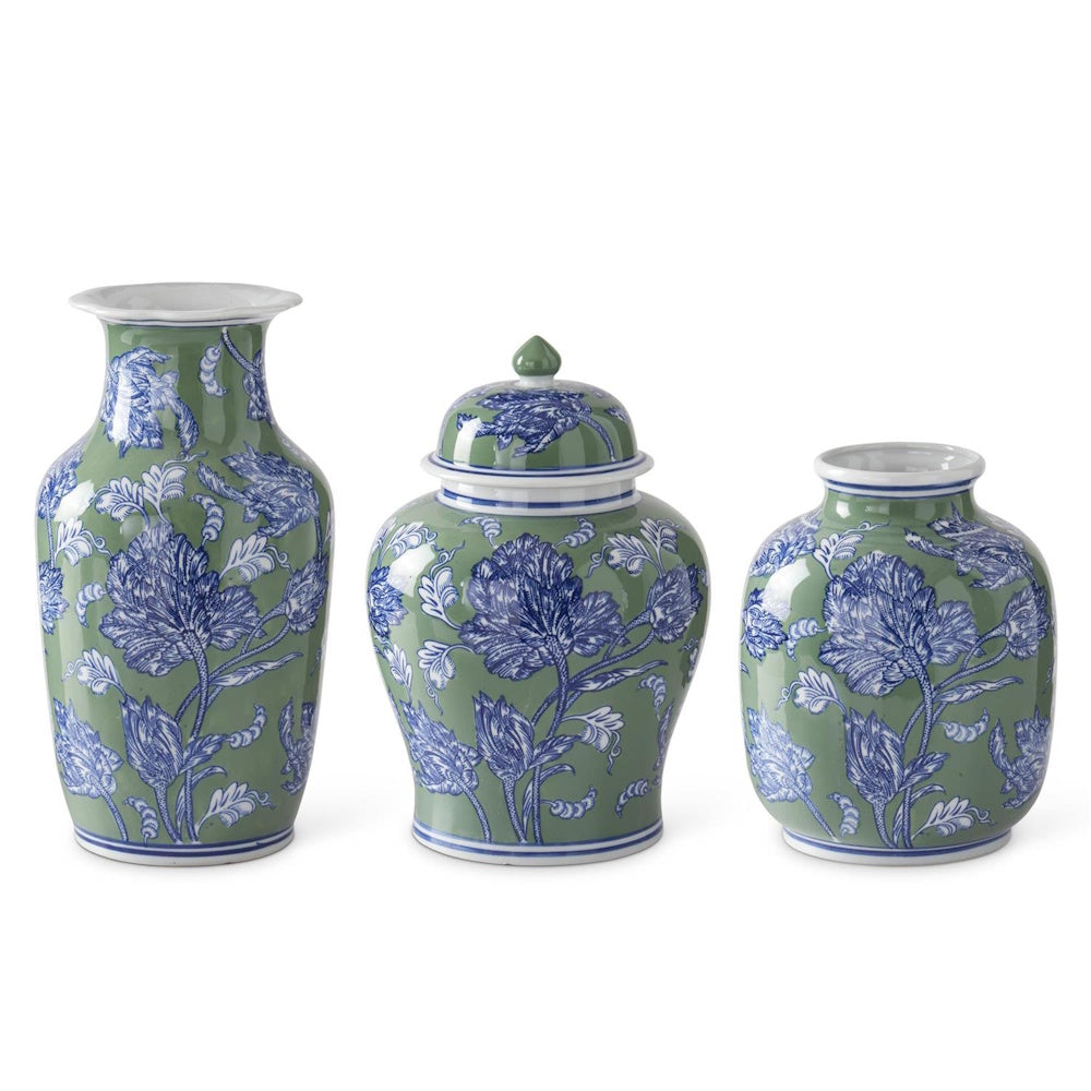 Set of three green and blue floral ceramic ginger jars and vases with white accents on a white background.