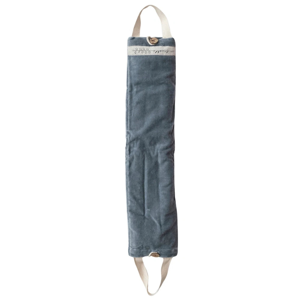 Microwavable hot and cold neck wrap with a slate blue velvet cover, button closures, and white fabric handles for easy use.