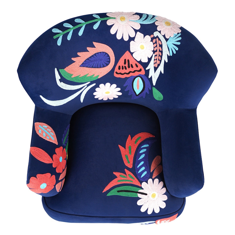 Top view of navy blue accent chair with colorful floral embroidery across the backrest, arms and seat cushion.