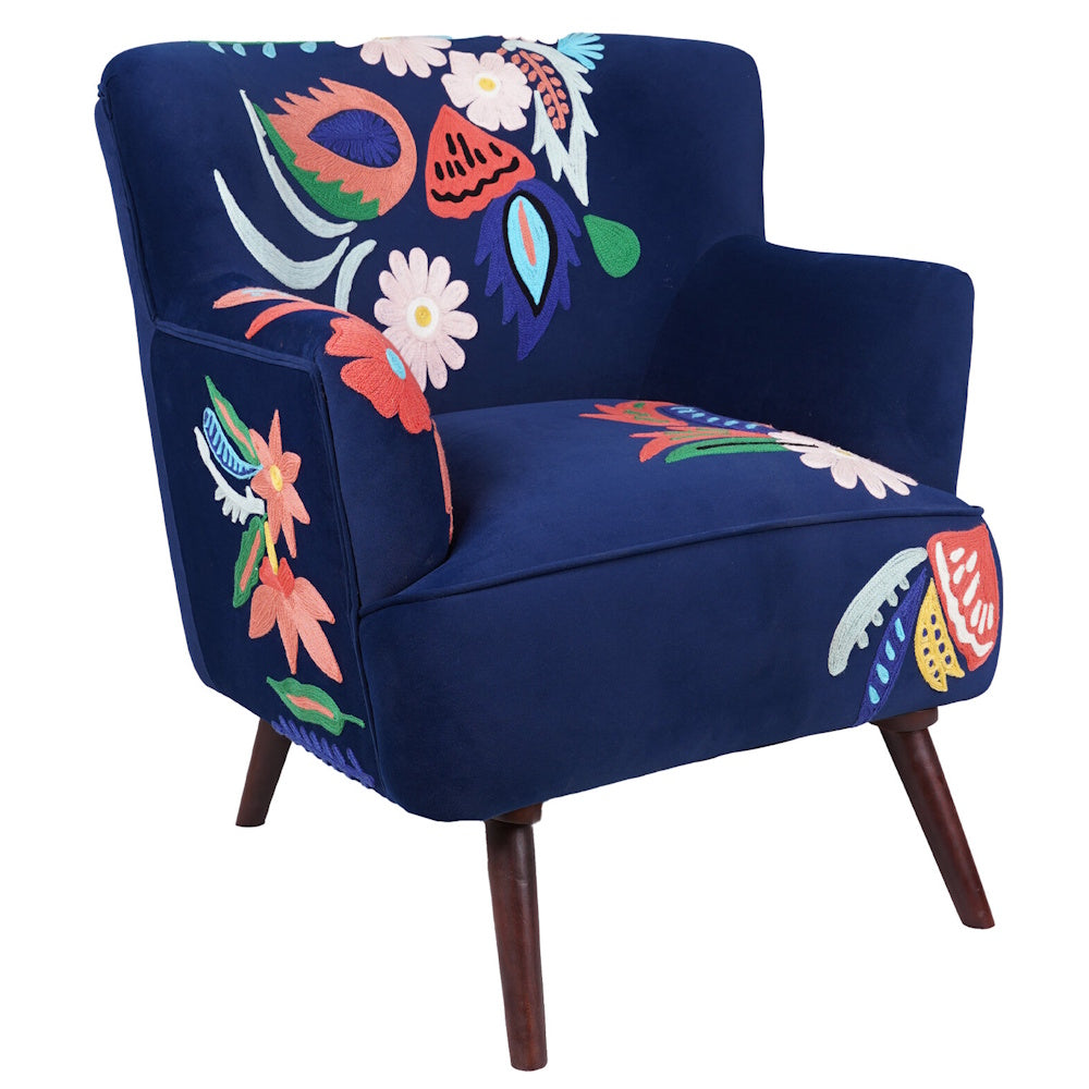 Navy blue accent chair with colorful floral embroidery, upholstered seat and angled wood legs for boho decor.