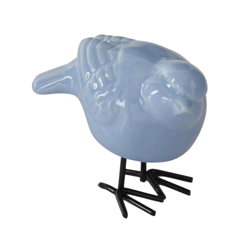 Light blue ceramic bird figurine with black metal legs and feet on a white background.
