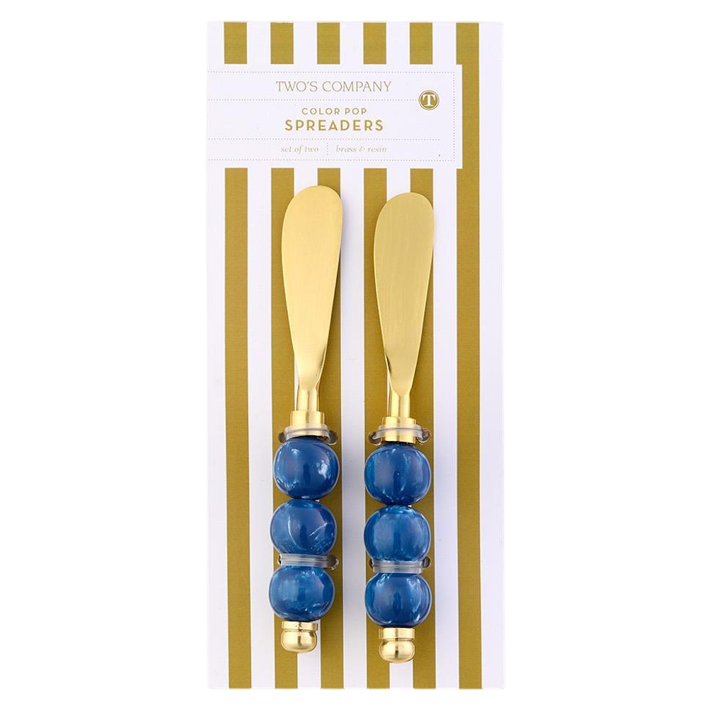 Two's Company set of 2 brass spreaders with blue beaded resin handles on packaging.