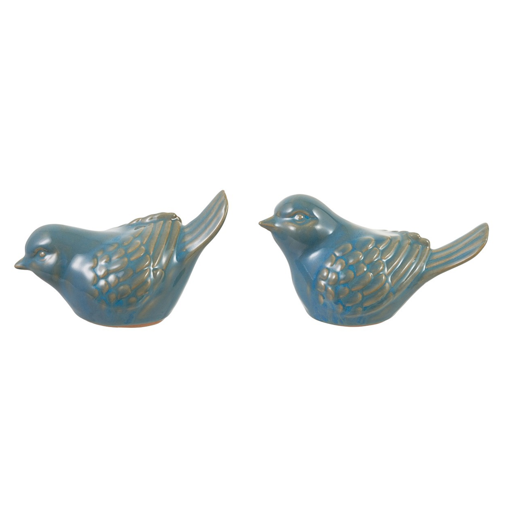 Two blue ceramic bird figurines with textured feather details, facing toward each other against a white background.