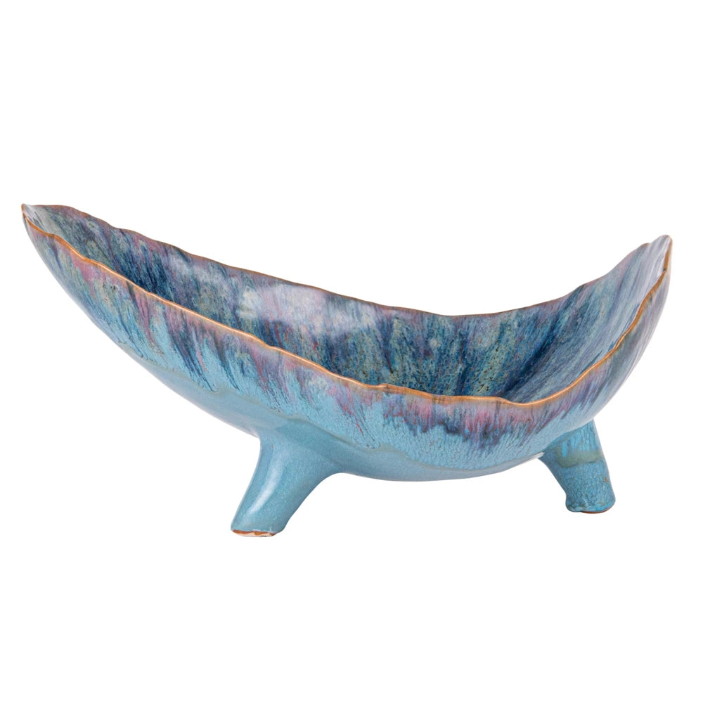 Blue stoneware footed organic-shaped decorative bowl with a reactive glaze in shades of turquoise, purple, and brown.