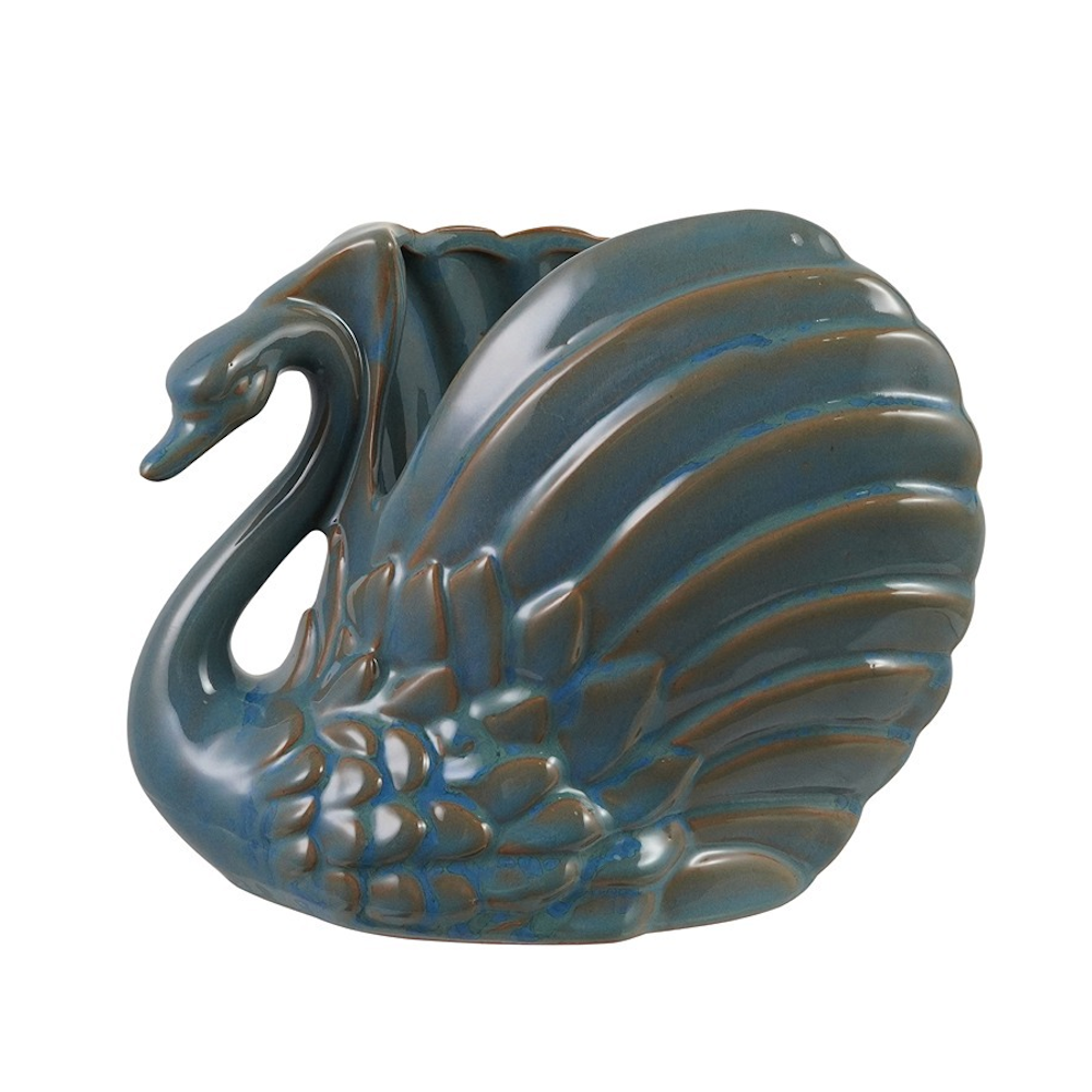 Glossy blue ceramic swan-shaped planter with brown-glazed accents and sculpted feather details.