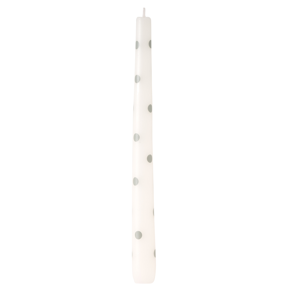White taper candle with blue polka dots on white background.