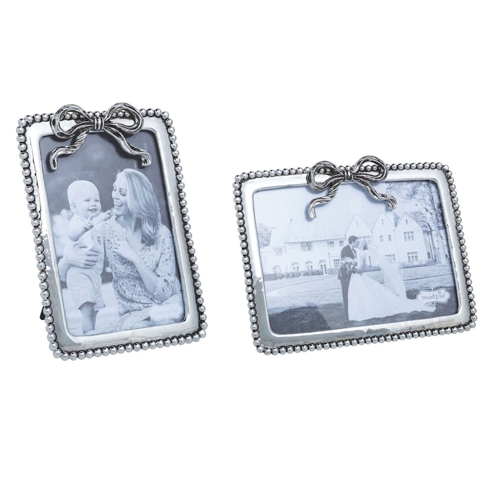 Silver beaded metal picture frames with ribbon bow detail in vertical and horizontal orientations.