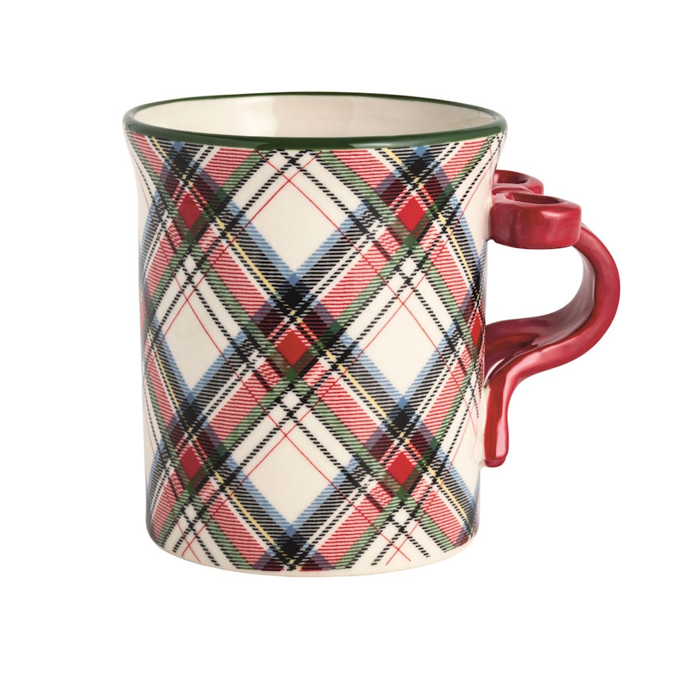 Ceramic mug featuring a red and green tartan plaid pattern with a red bow-shaped handle.
