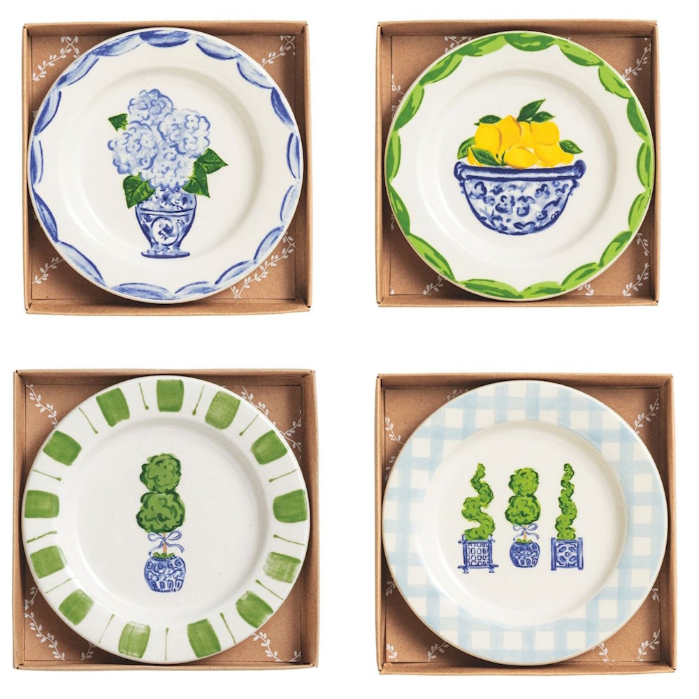 Set of four ceramic tidbit plates with blue and green topiary, hydrangea, and lemon designs in kraft gift boxes.