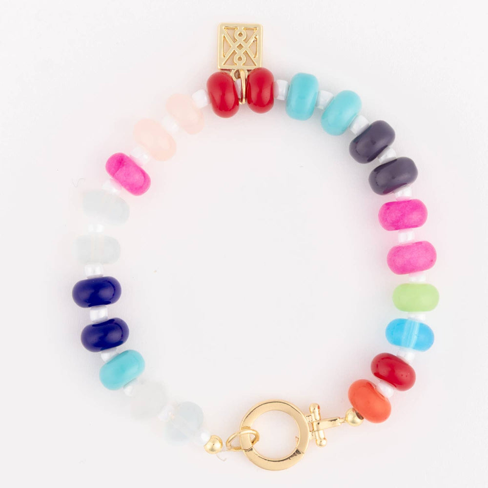Multicolor beaded stone bracelet featuring a gold charm and toggle clasp closure.