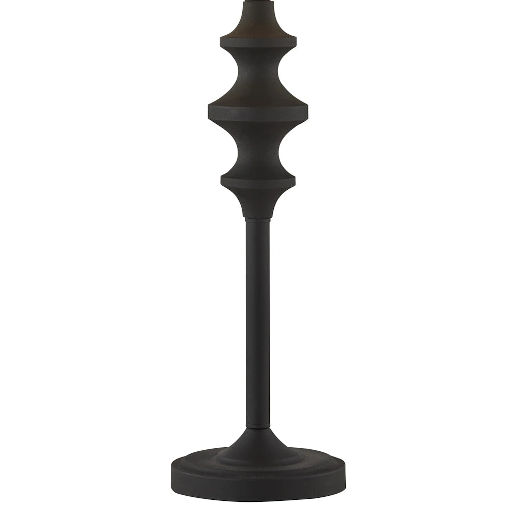 Close up of black metal buffet table lamp stem with sculpted detail and round base.