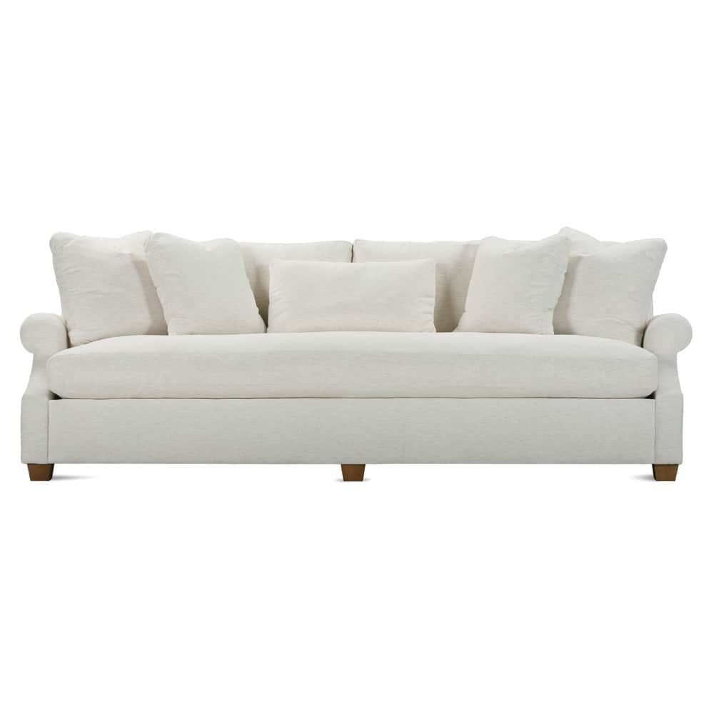 Modern off white Bristol fabric sofa with rolled arms, plush throw pillows, and square wooden legs.