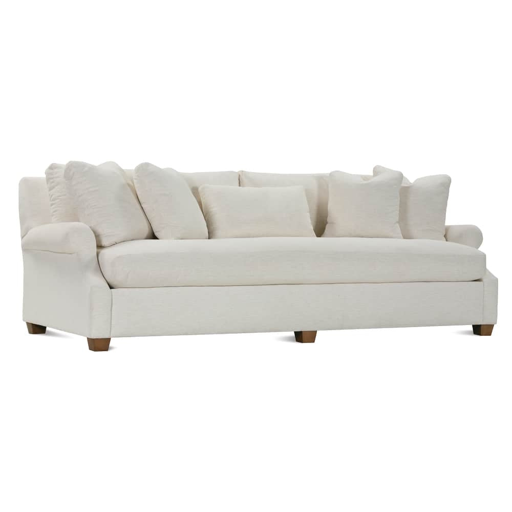 Modern off white fabric sofa with rolled arms, plush throw pillows, and square wooden legs.
