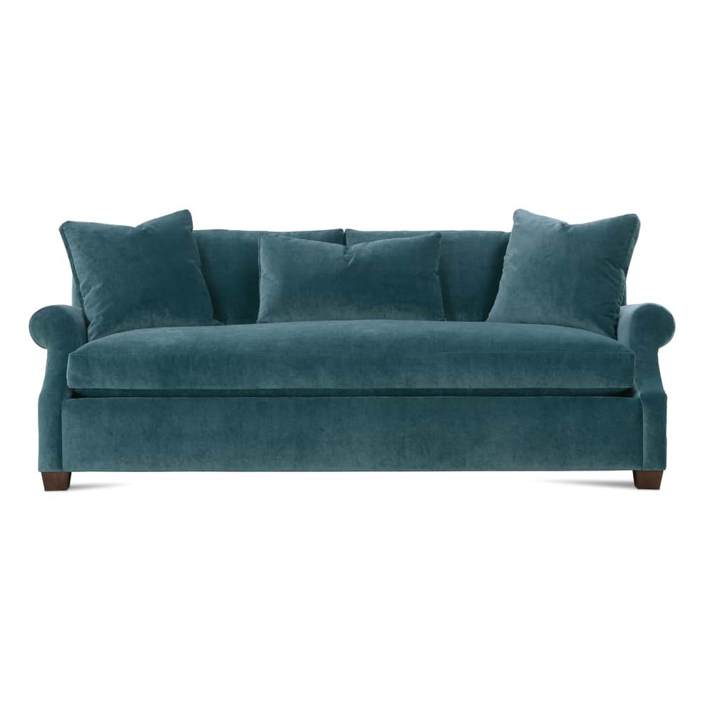 Modern teal blue velvet Bristol sofa with rolled arms, plush throw pillows, and square wooden legs.
