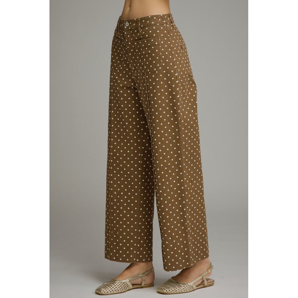 Side profile of brown white-polka-dot wide-leg pants featuring patch pockets.