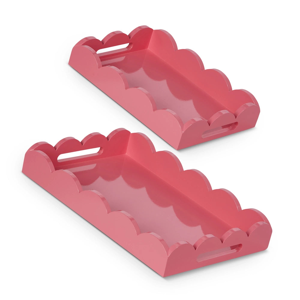 Two pink trays with scalloped edges and cutout handles, one larger than the other, are stacked slightly offset on a white background.