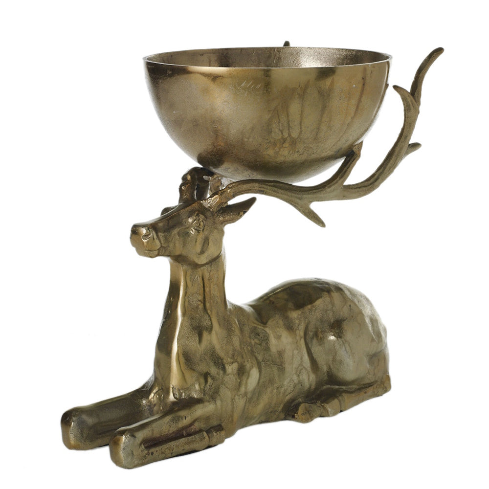 Decorative brass reclining deer figurine supporting a bowl on its antlers, on a white background.