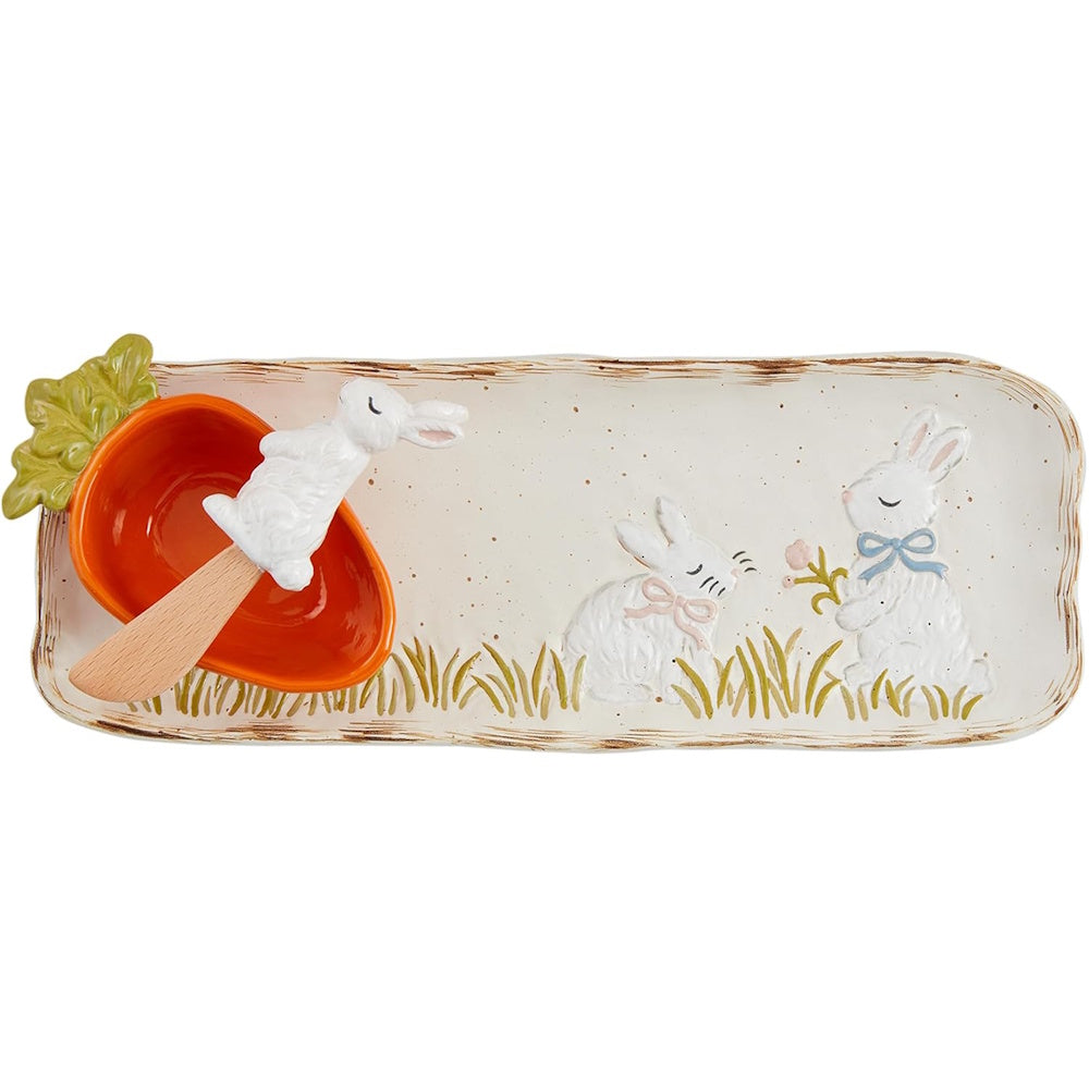 Ceramic Easter serving tray featuring bunny designs, a carrot-shaped dip bowl, and a matching spreader.