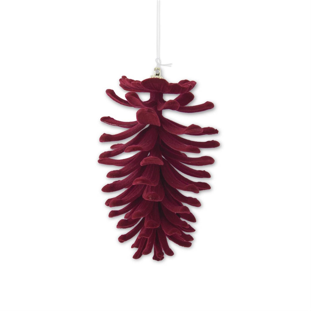 A hanging burgundy velvet-flocked open pinecone Christmas ornament.