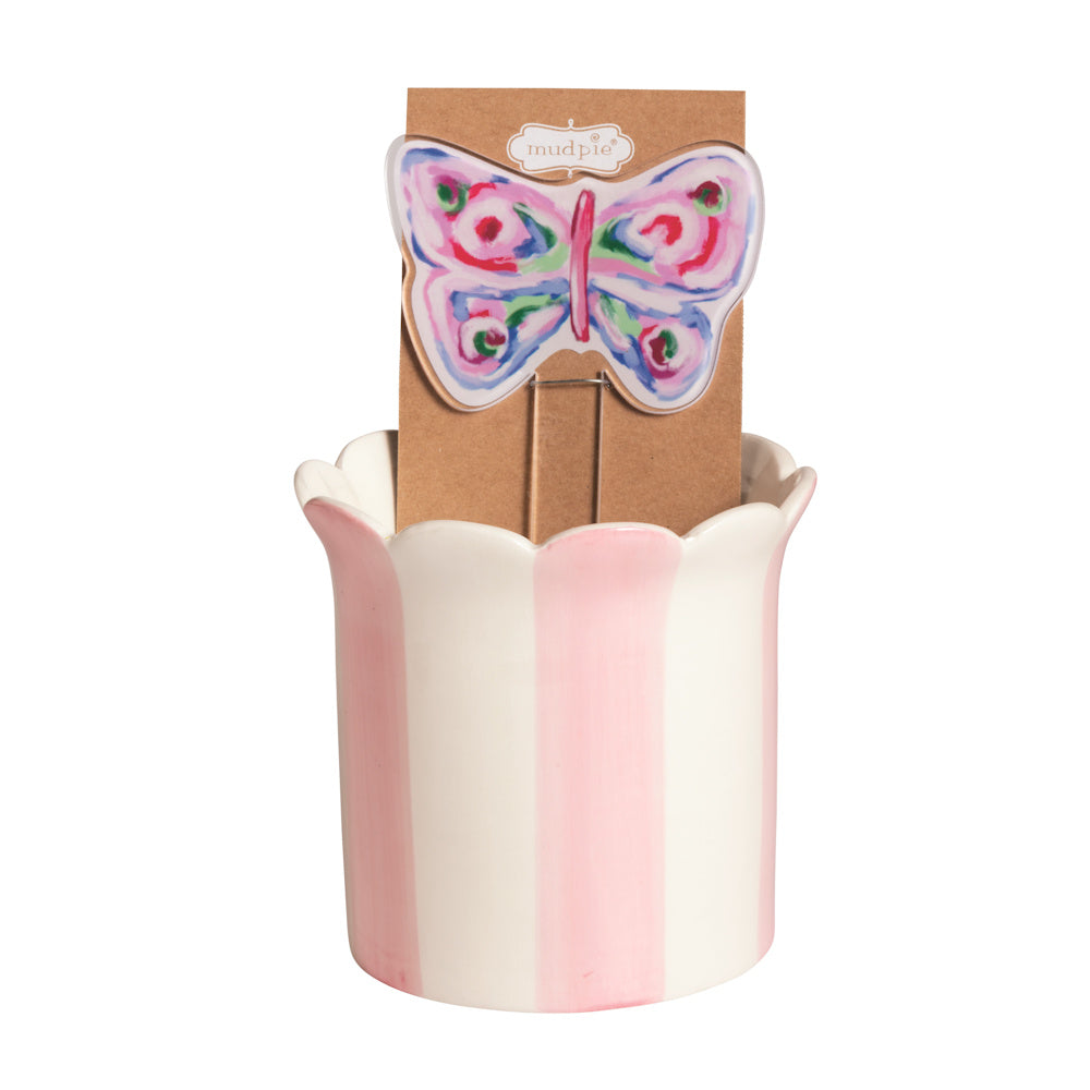 Pink and white striped ceramic planter with a colorful butterfly plant stake by Mud Pie.